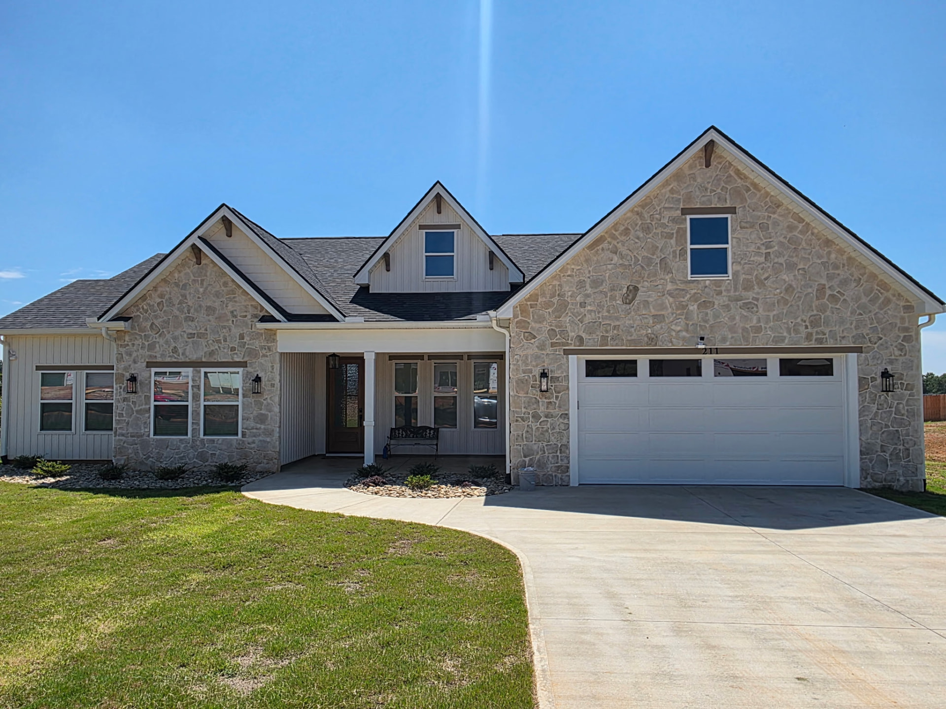 Completed home clad in light natural stone