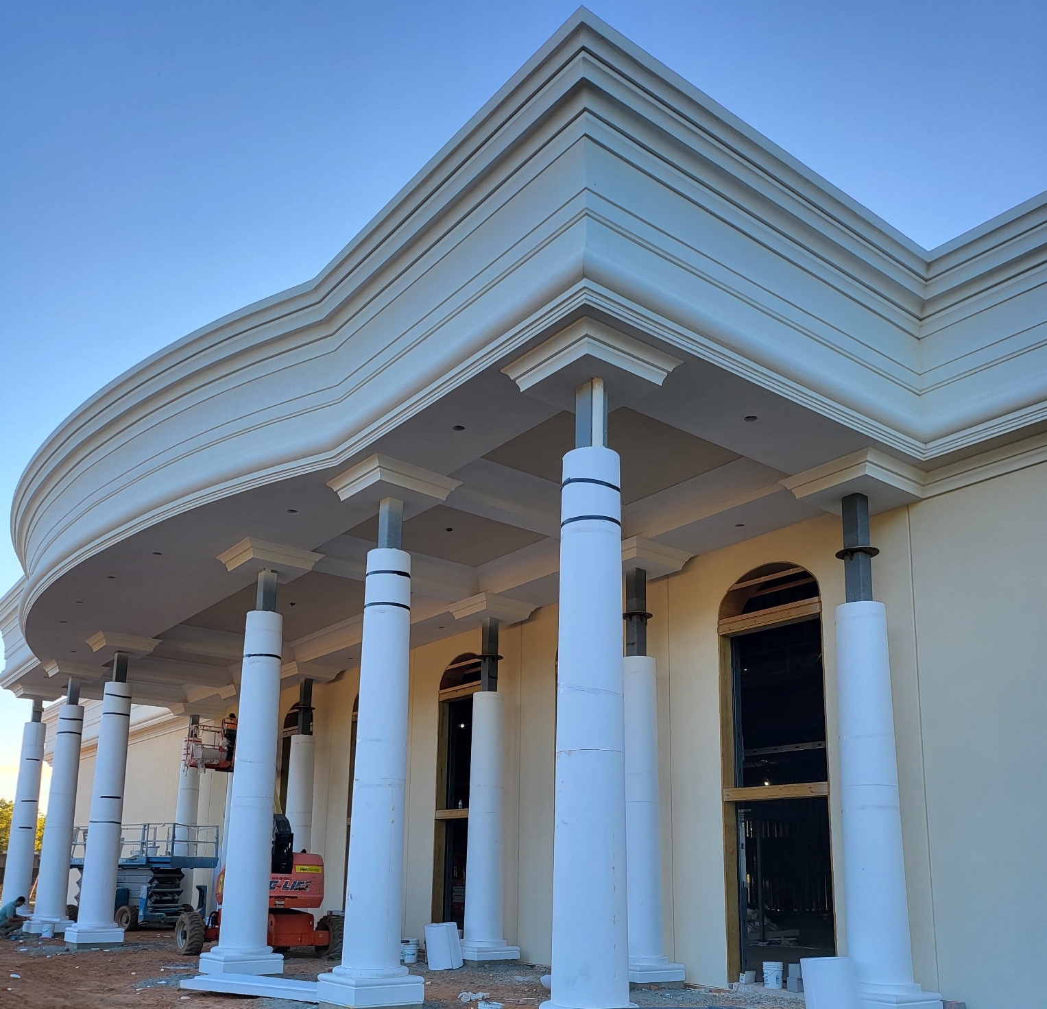 Commercial church exterior with large architectural columns and masonry details