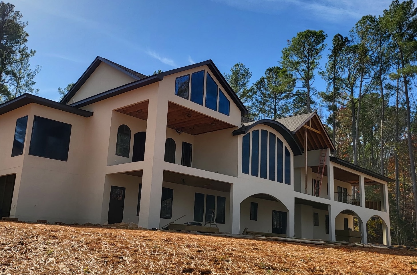 Residential stucco home with modern architectural design by Premier Landscape Rock