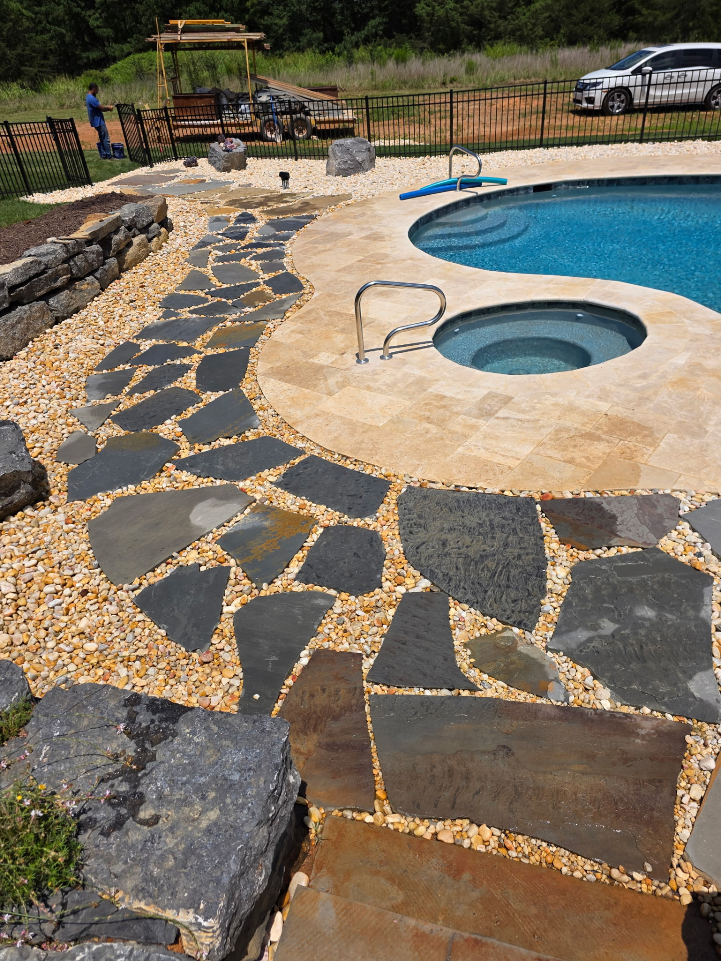 Flagstone walkway and landscape beside a residential pool