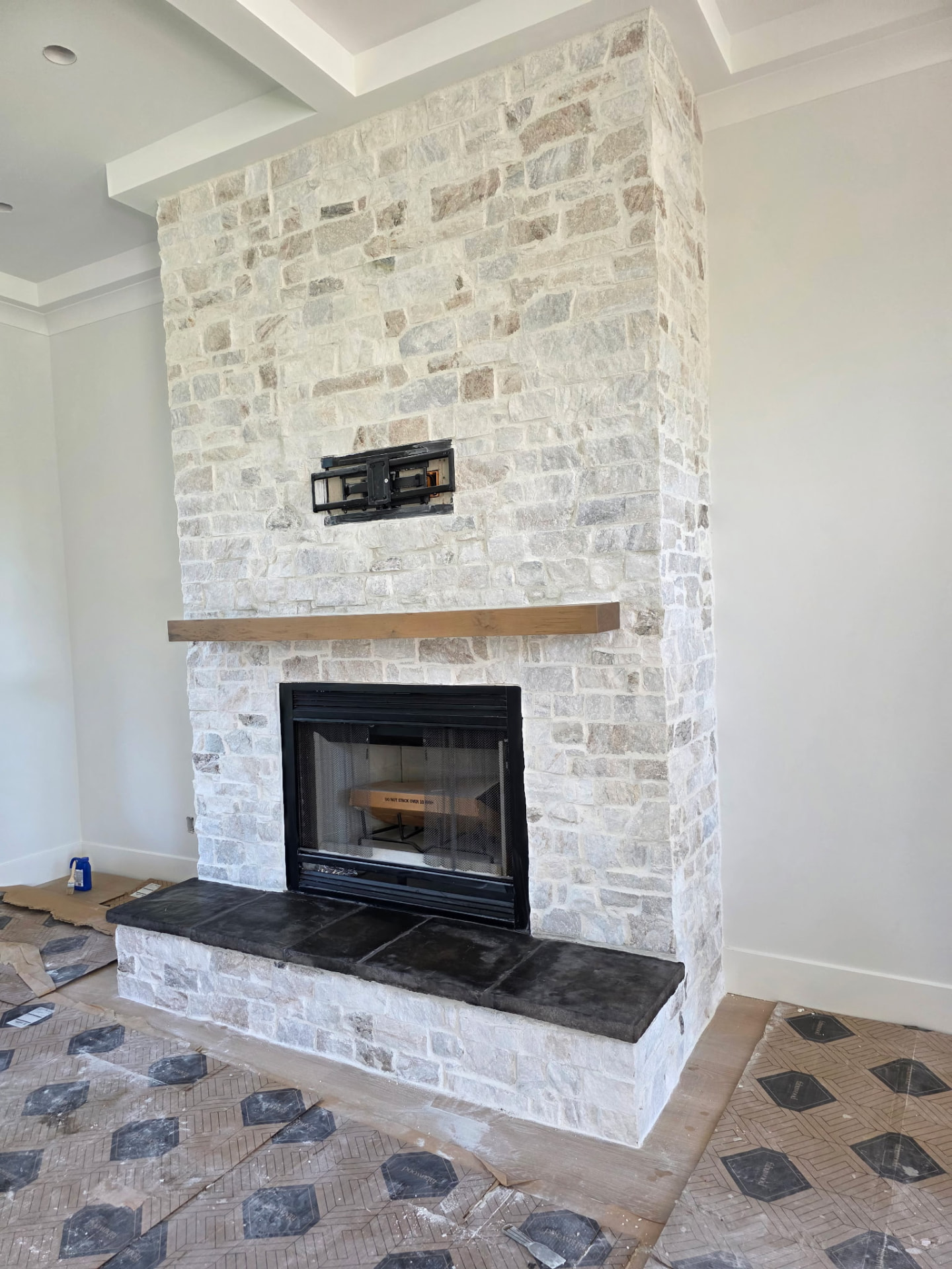 Floor-to-ceiling natural stone indoor fireplace